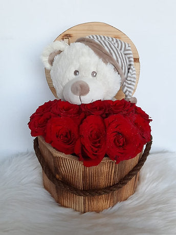 Fresh Red Roses in Wooden with cute Bear in a Log Box